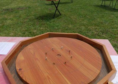 Le crokinole - jeu d'adresse